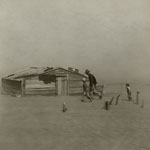 farmer wlaking in a 1930s dust storm