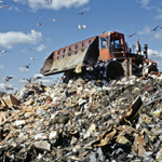 bulldozer on a municipal waste landfill pile