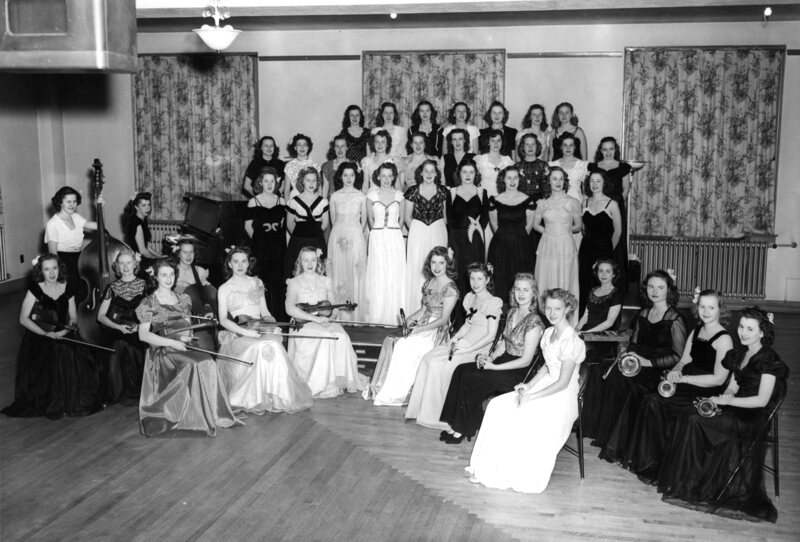group photo, all-girl orchestra and chorus