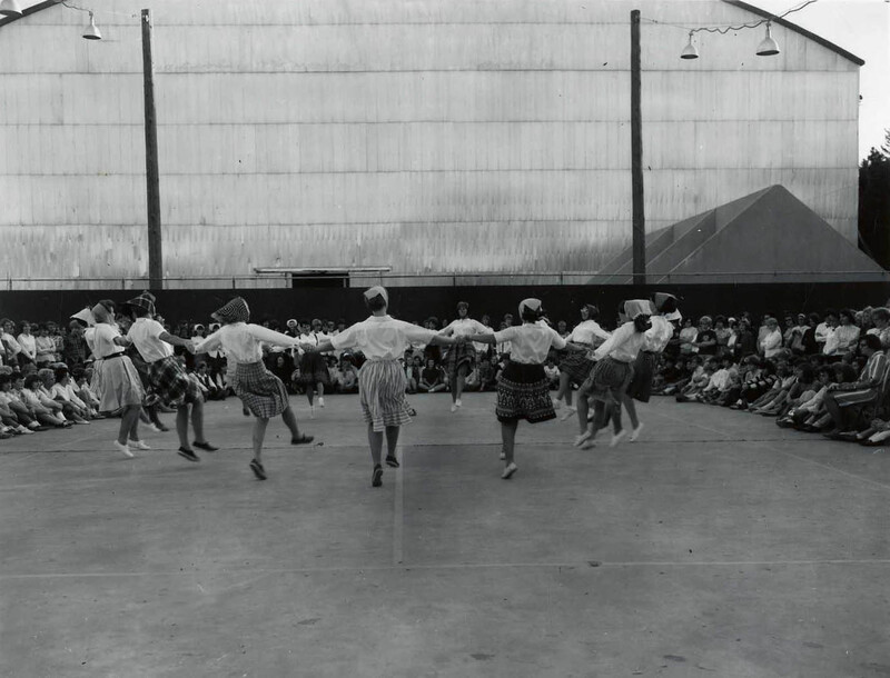 women dancing at Folk Dance Festival outside the Kibbie Dome