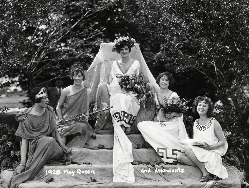 five women - the May Queen and Attendants - sitting together for photo