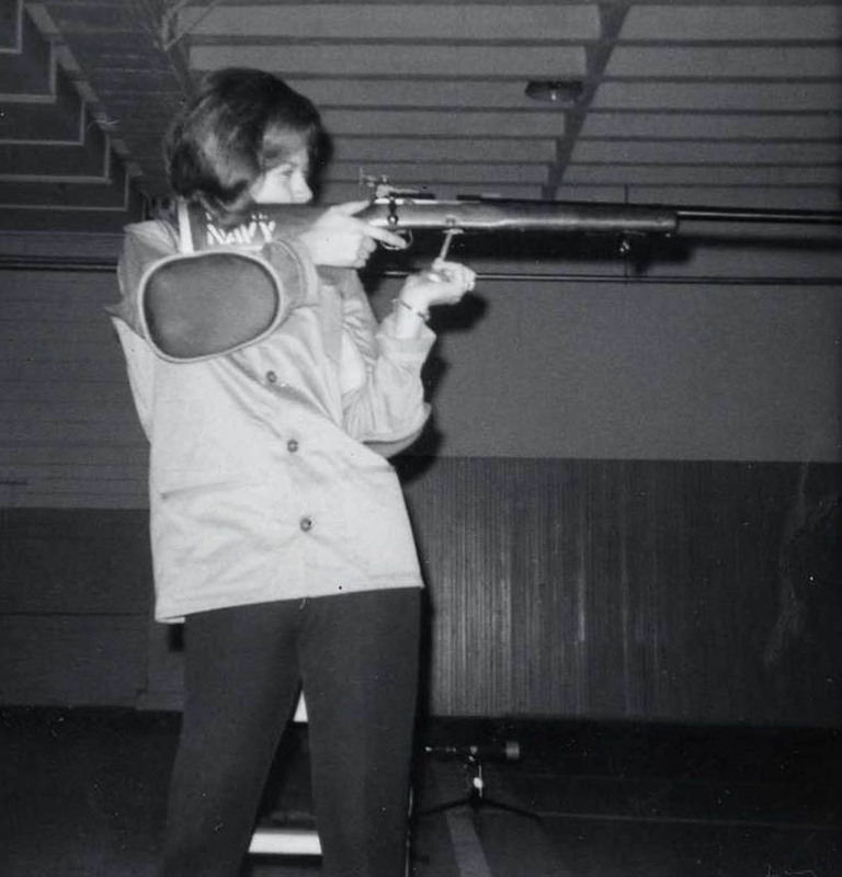 woman shooting rifle in ROTC