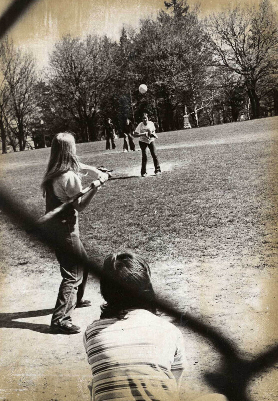 women playing softball on Administration Building lawn