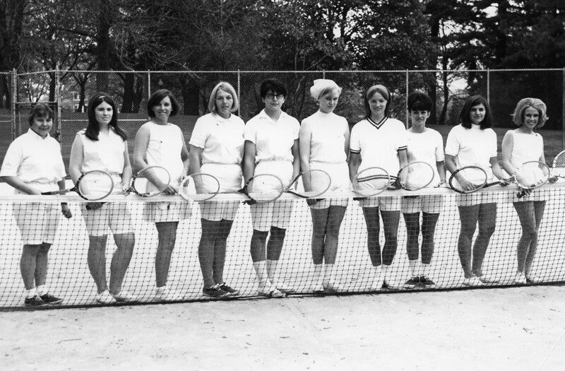 ten tennis team members standing together for photo