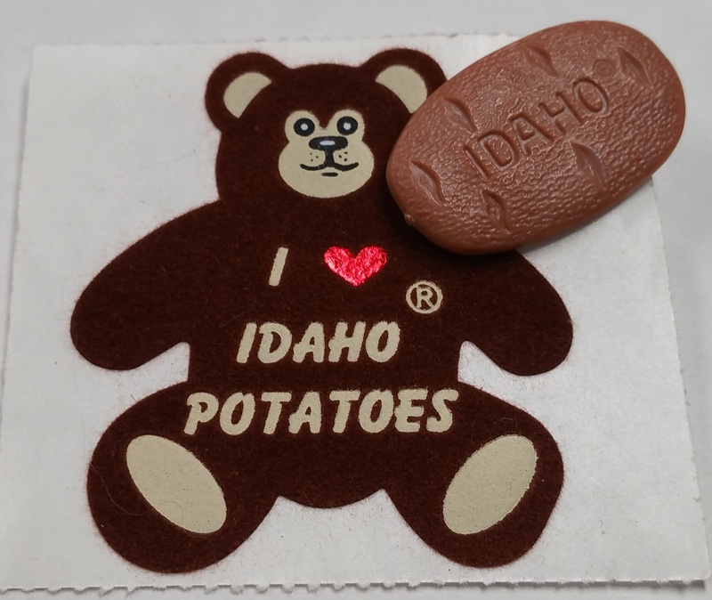 fuzzy bear sticker and potato-shaped pin