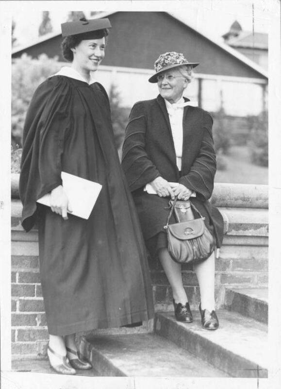 Julia Moore, left, wearing the same gown her mother, Mrs. F. Cushing Moore, wore when she received degree in 1898. Mrs. Moore was Margaret McCallie.