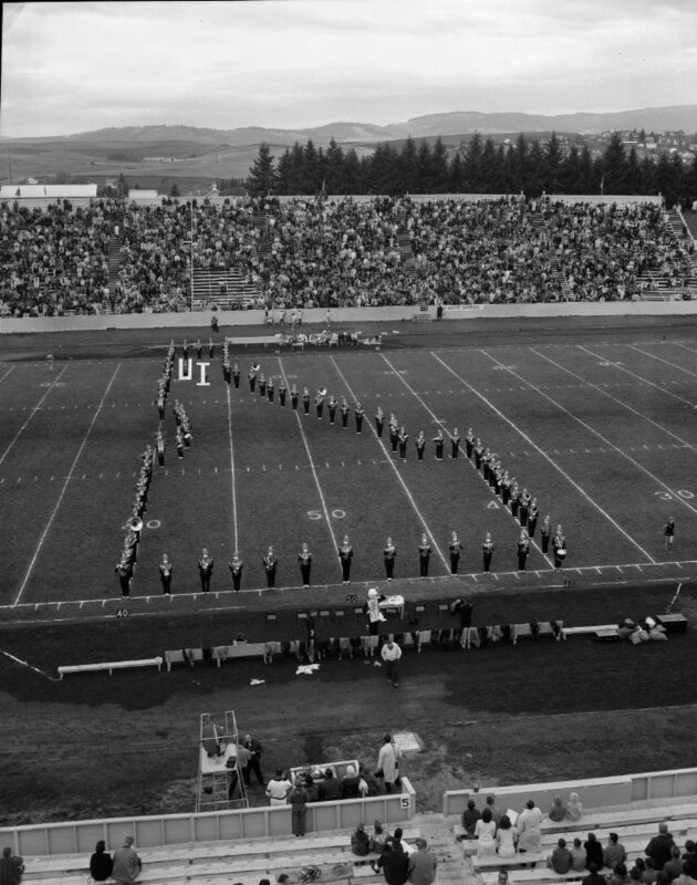 marching band froming an "I" on the field during Homecoming game halftime show