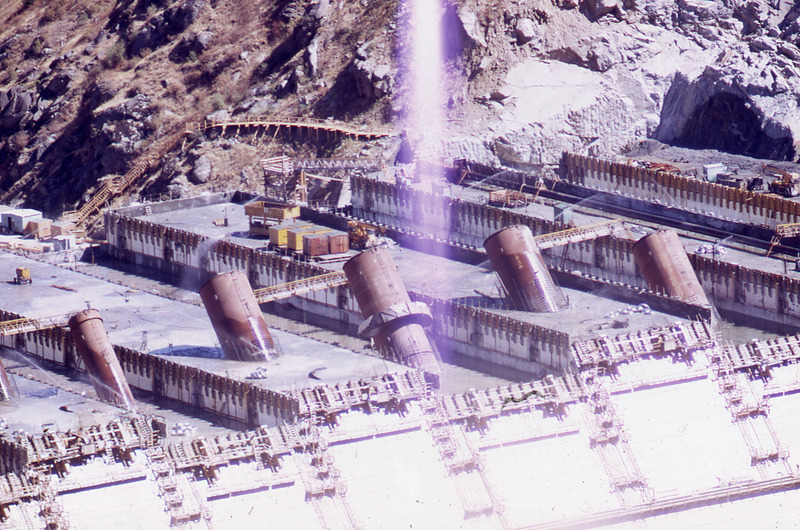 the penstock tubes going up as the concrete is laid at the Dworshak Dam construction site
