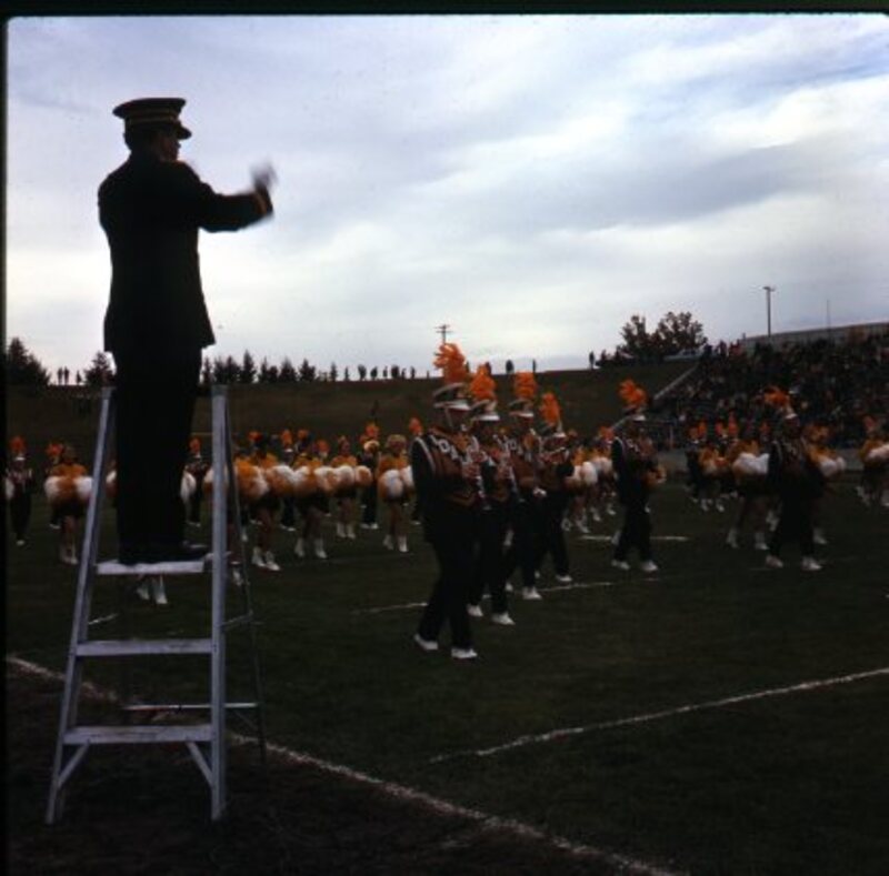 band on field during half-time at Homecoming football game
