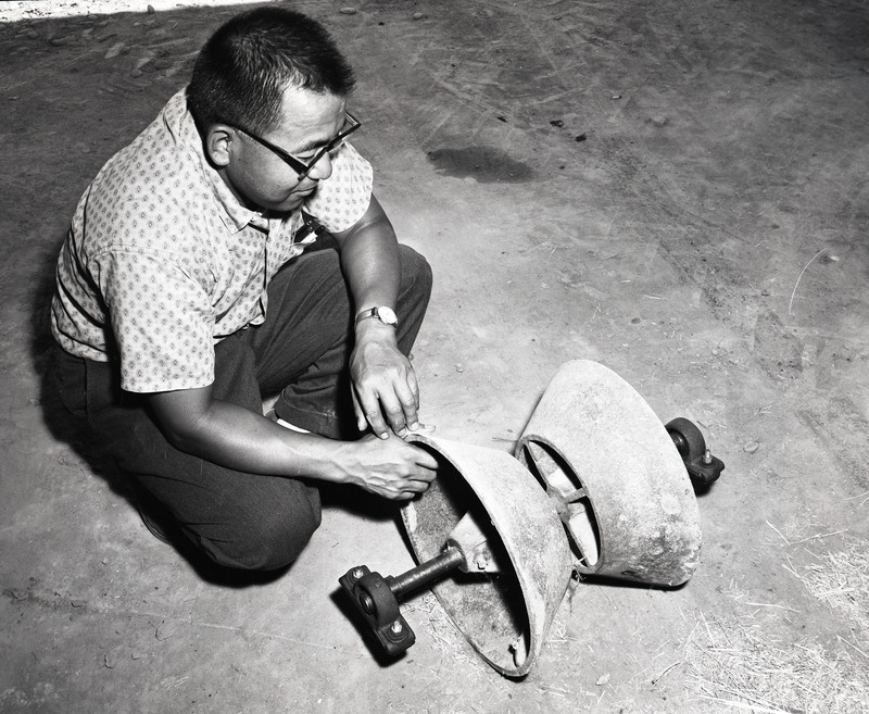 Willy M. Iritani with press wheel