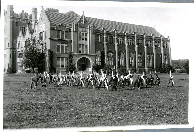 group of male 4-H Club members performing exercises in front of the University of Idaho Administration Building