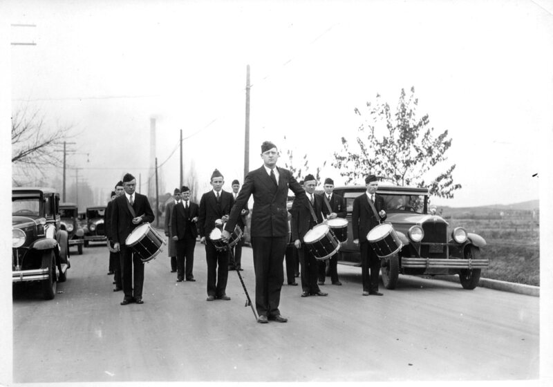 percussion marching band, man with cigar leading with baton