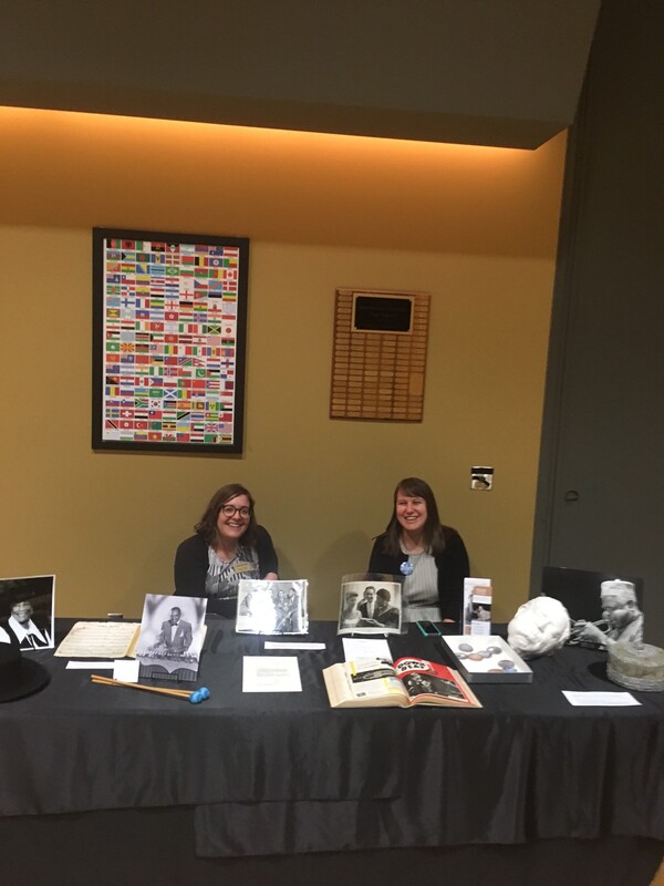 Ashlyn Velte and Erin Stoddart displaying materials from the International Jazz Collections at Ted Gioia's presentation