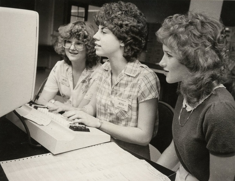 three women at a computer