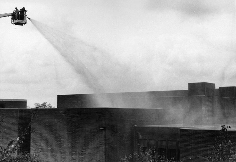 employees washing volcanic ash off the Menard Law Building after Mt. St. Helens eruption